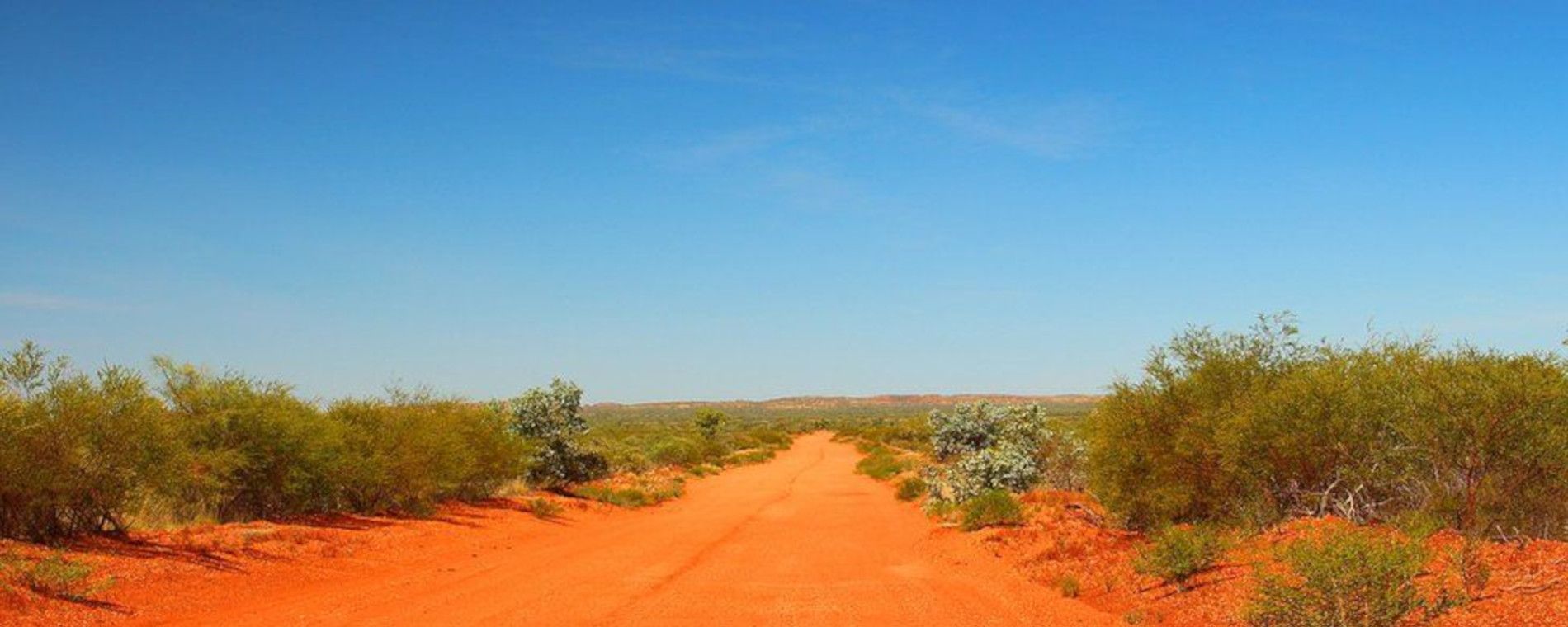 Remote Australian outback landscape under a clear blue sky